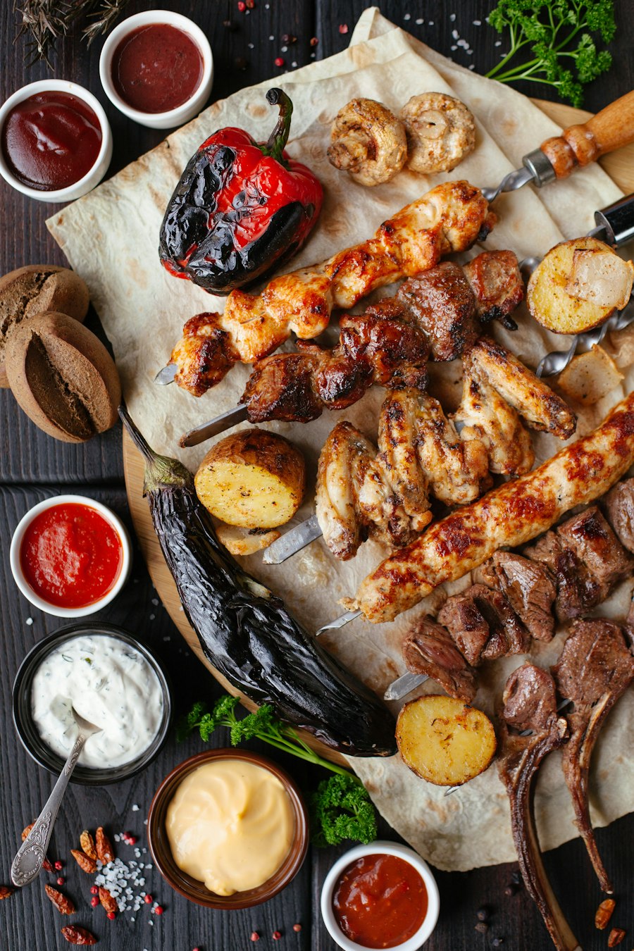 A prepared restaurant meal with grilled food and sauces