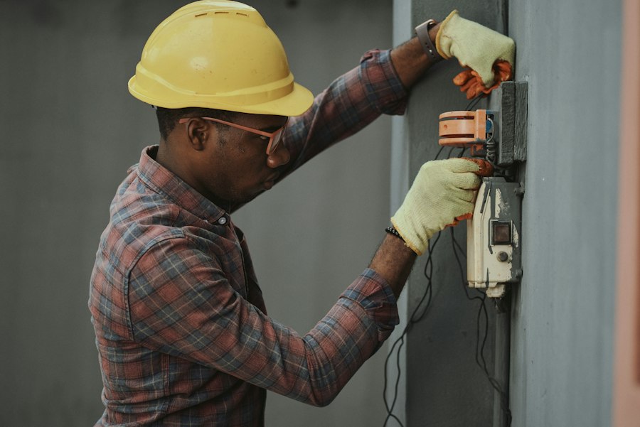A tradesperson carrying out an electrical repair