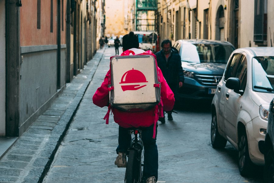 A courier delivering an order by bicycle
